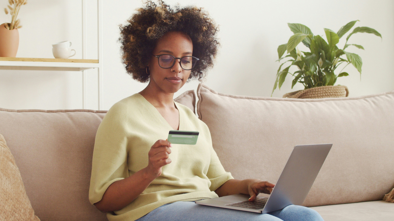 Black woman using laptop to make an online payment
