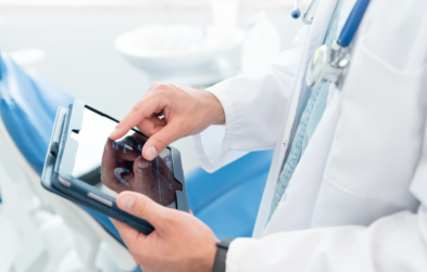 Doctor looking at patient chart in tablet.