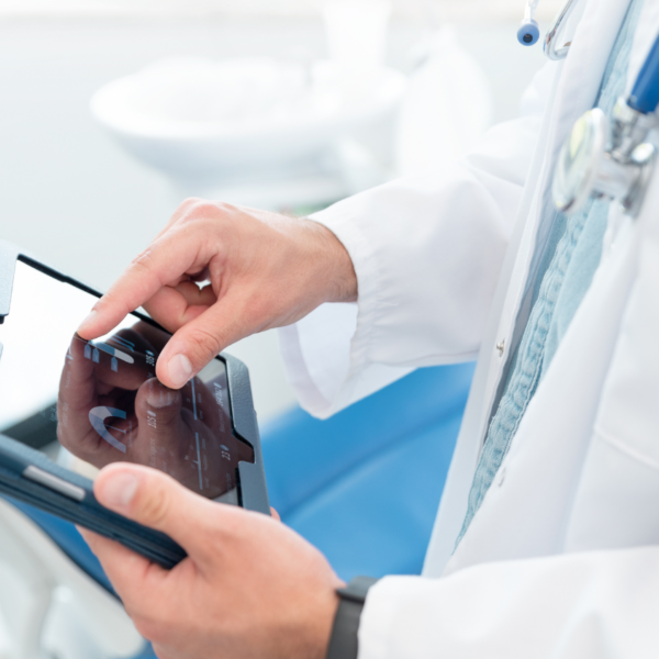 Doctor looking at patient chart in tablet.