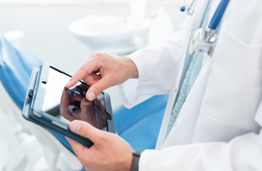 Doctor looking at patient chart in tablet.